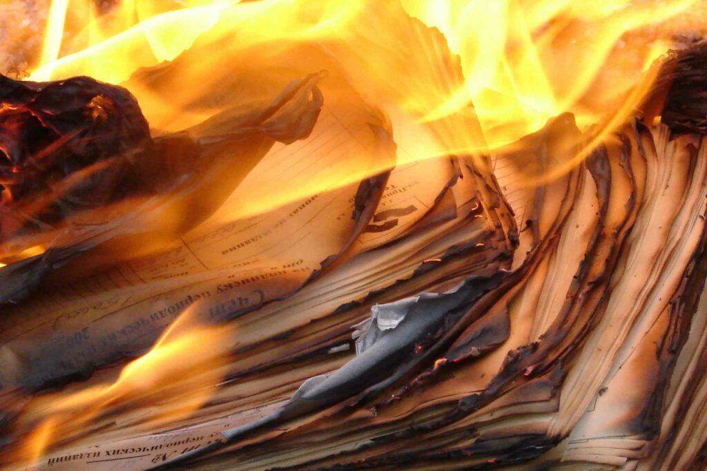Image of documents on fire.